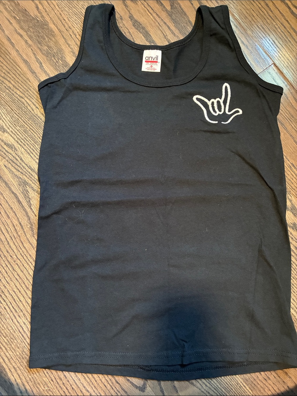 Anvil Black Tank Top with 🤟🏼 handshape